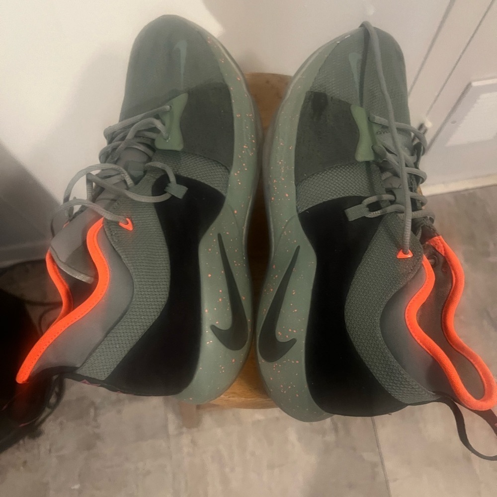 Nike Gray and Orange Athletic Shoes with Sleek Design